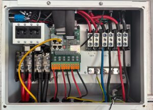 Open electrical control panel showing circuit breakers, cable terminations and busbar connections representative of LT/HT cable jointing and termination work