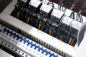 Control panel wiring - bunches of wires landed into terminals inside an industrial switch box